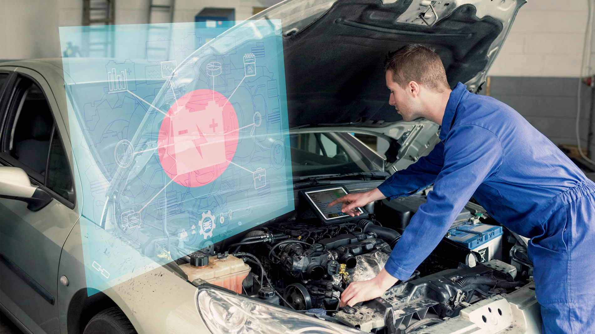 Automotive mechatronics technician examines car with tablet