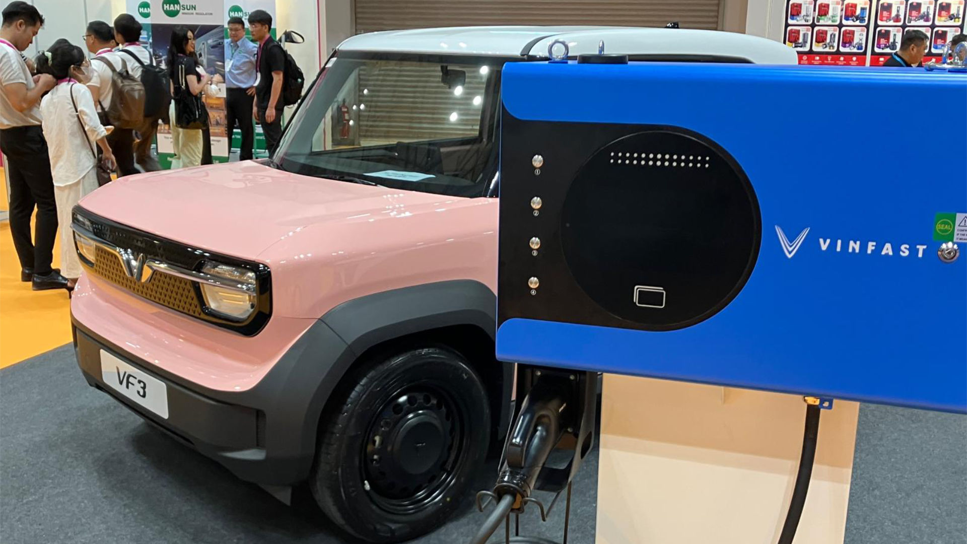 E-charging station next to an electric car