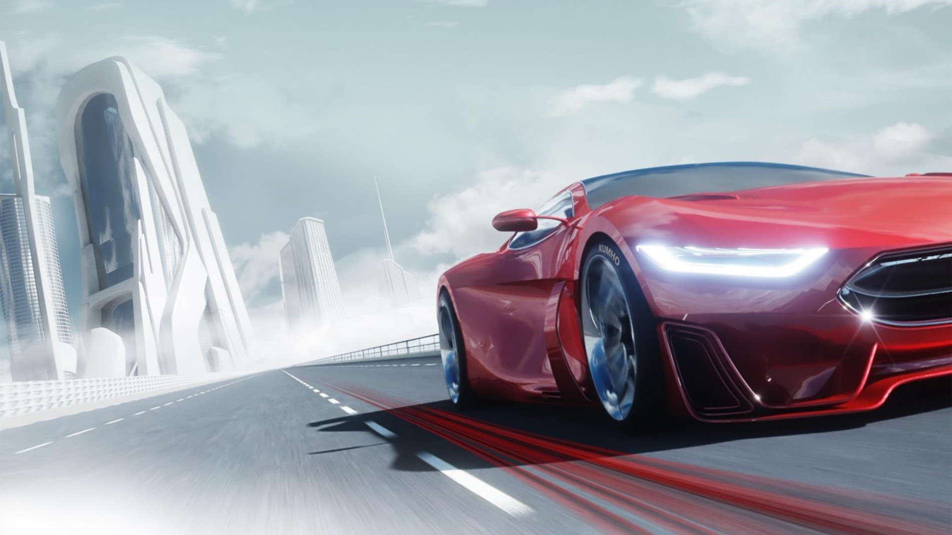 Red sports car fitted with Kumho tyres driving through a futuristic cityscape