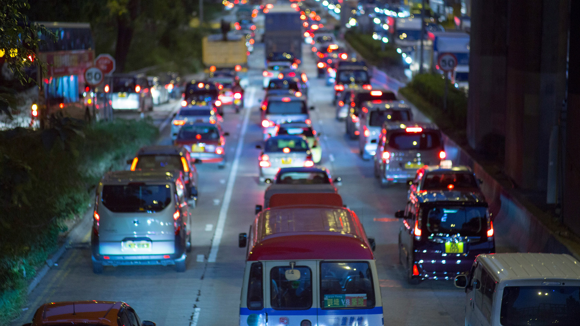 Many cars on a three-lane road
