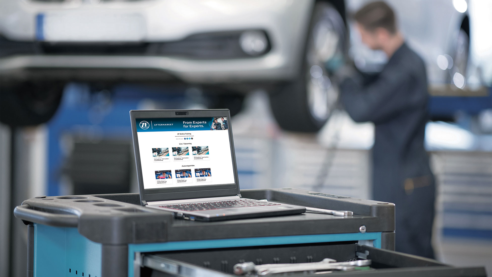 Laptop displaying ZF Aftermarket training tools on a workshop trolley