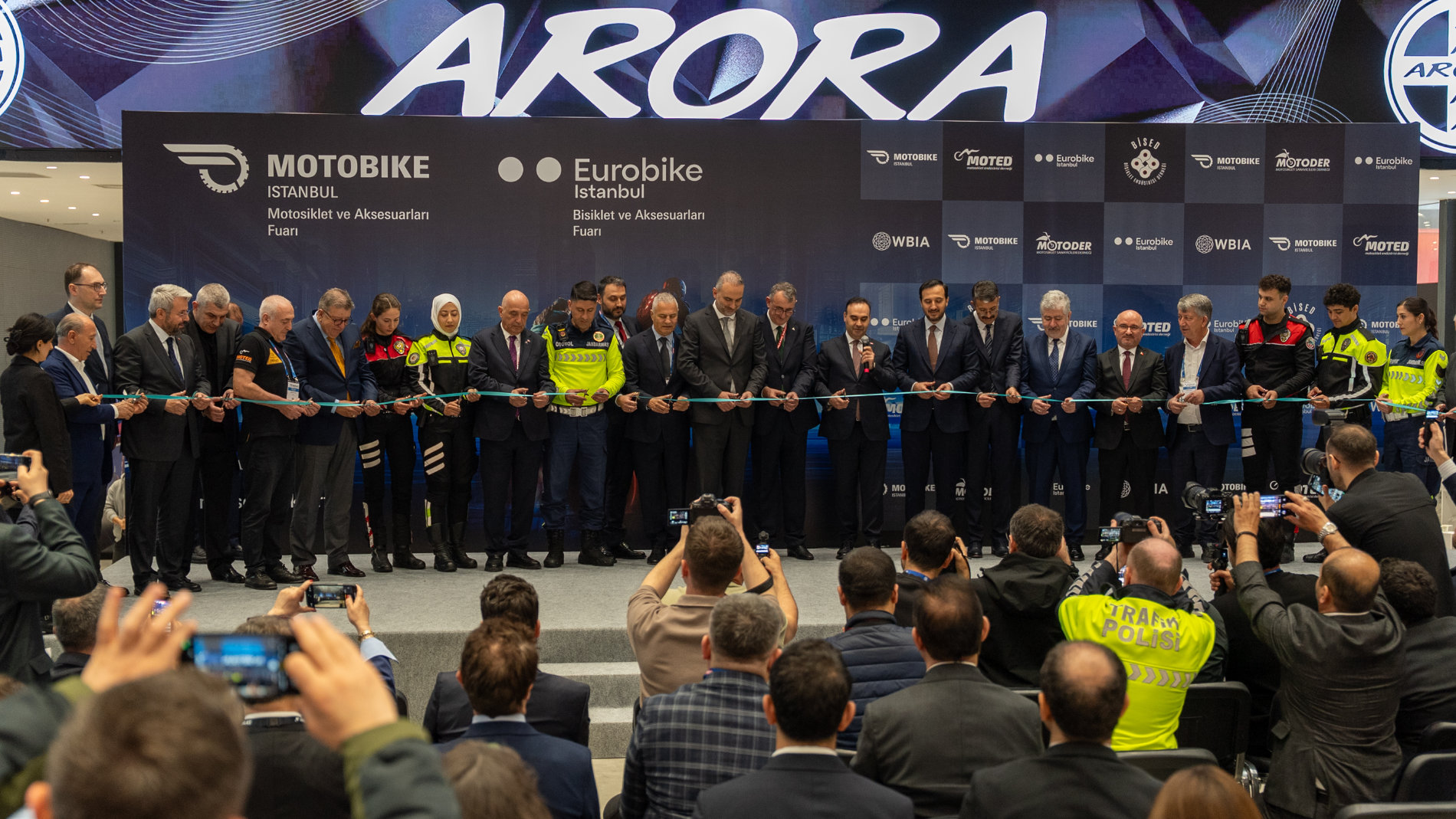 Opening ceremony with a ribbon-cutting on the exhibition stage