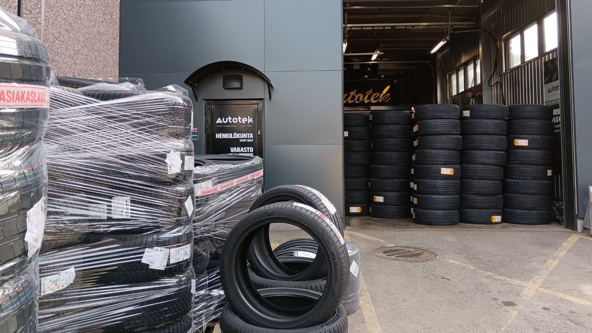 Tyre warehouse with stacked car tyres