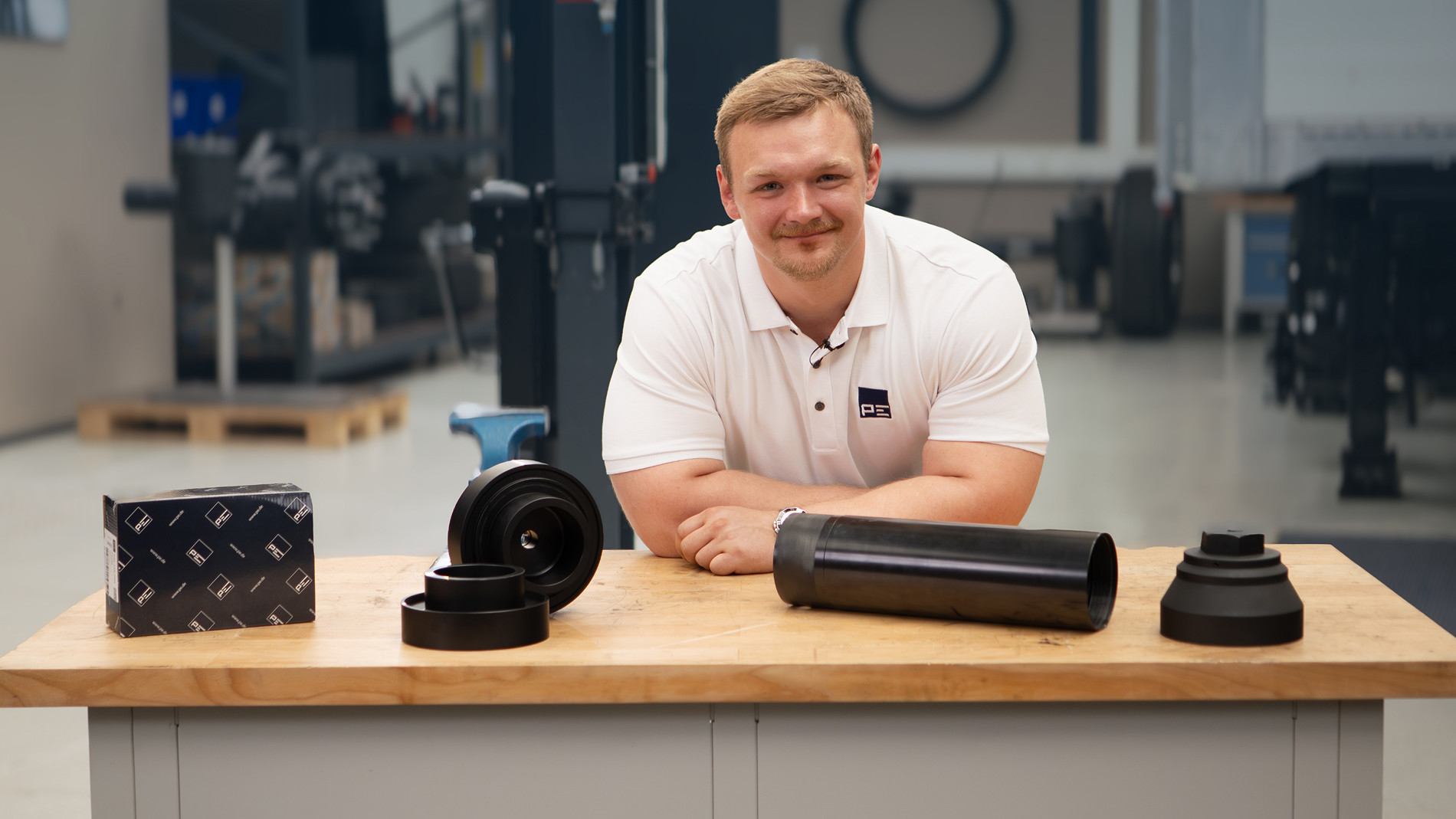 Employee presenting components for commercial vehicle wheel hubs