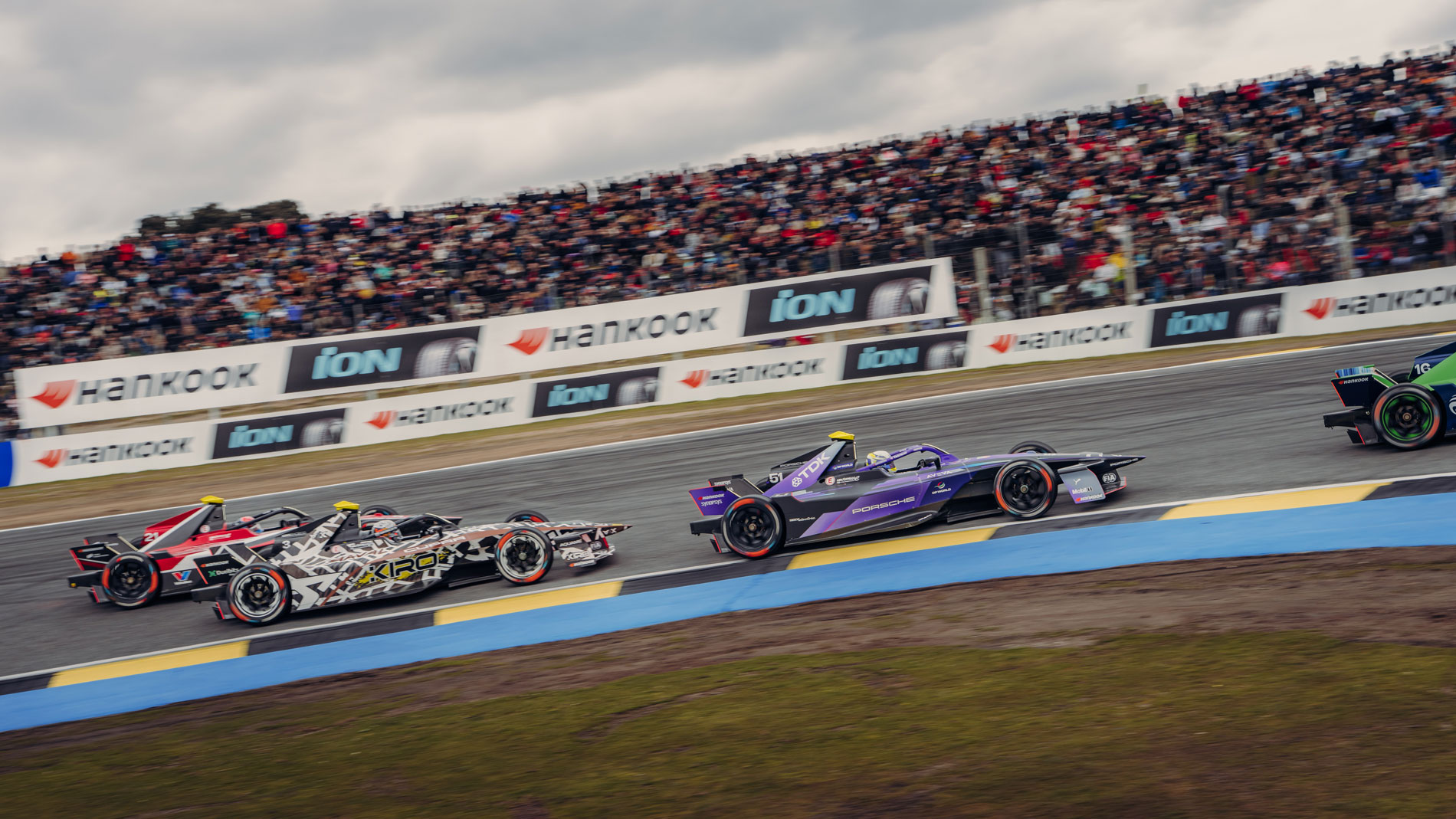 Porsche Formula E race car in close battle