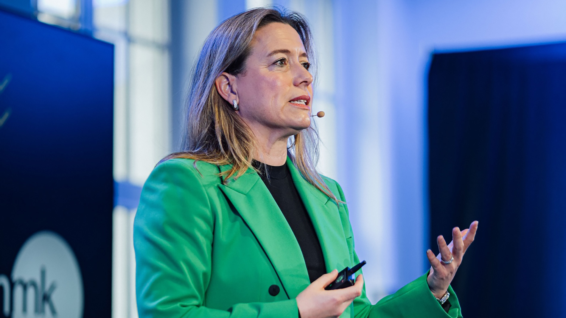 Sabine Scheunert speaks on stage at a specialist event